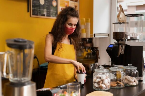 barista-wearing-medical-mask-work_23-2148767430